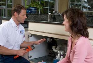Keller plumbing technician consults with a customer